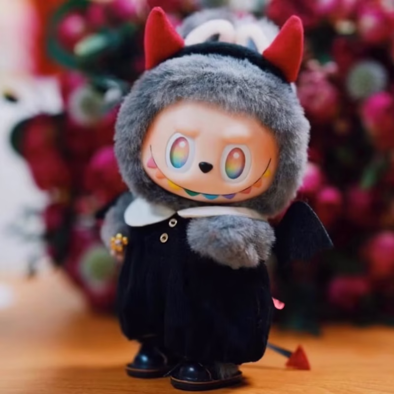 The product includes Doll Labubu, a 17 cm plush, and comes with a Do it Yourself Pajama Headband Monster Outfit for kids.