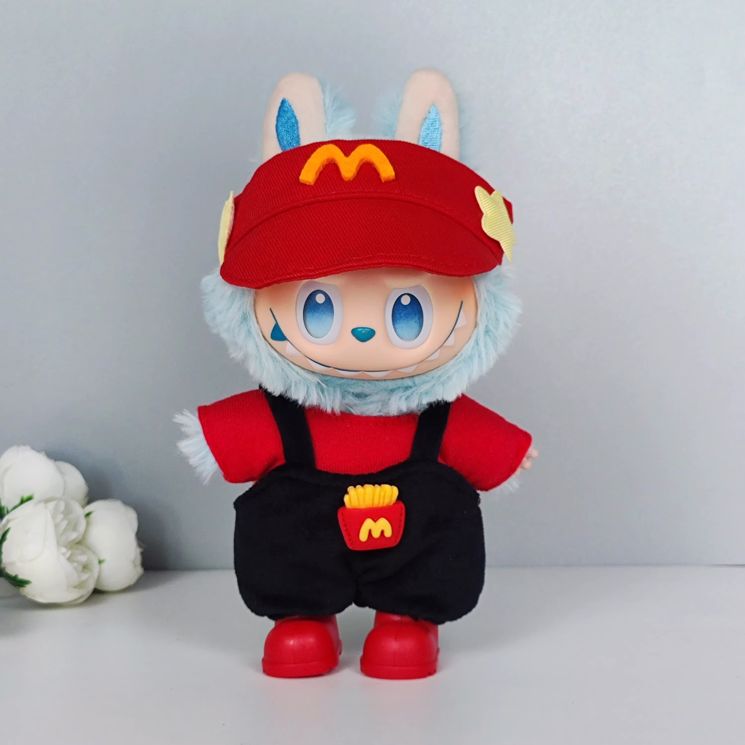 The Labubu Idol V1 V2 17cm fashion miniature doll holds a sporty, leisure with accessories and a zip suit - Image 2