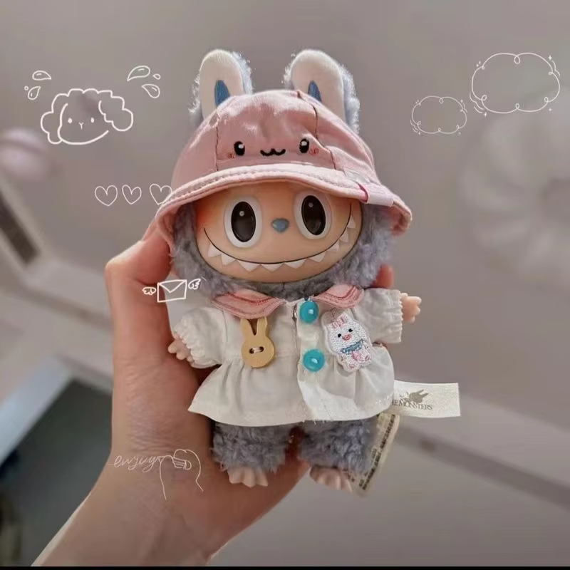 The outfit for the 17cm Labubu Doll Toy Adorable Little Plush Doll includes the rest of the doll’s clothes, accessories, jumpsuit, and dress for kids.
