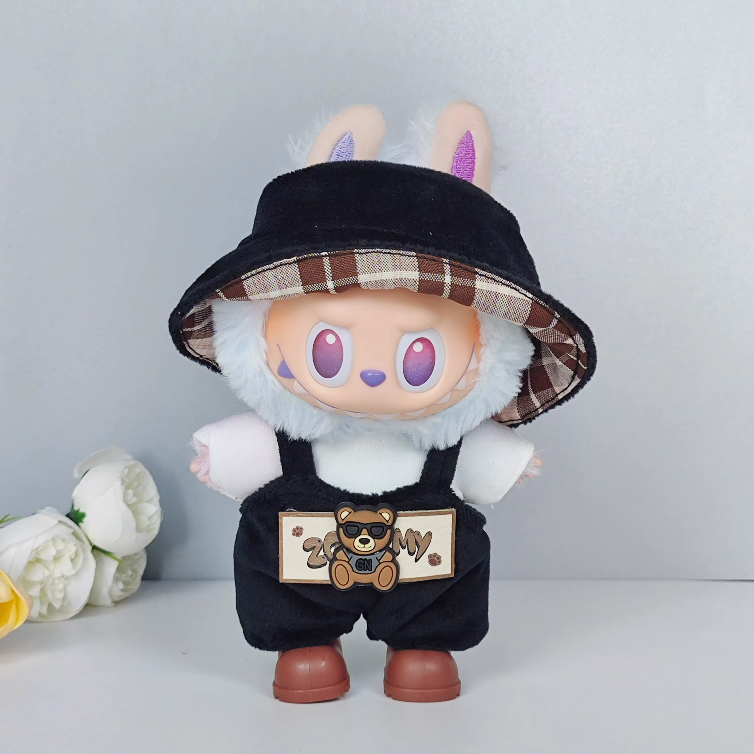 The Labubu Idol V1 V2 17cm fashion miniature doll holds a sporty, leisure with accessories and a zip suit - Image 4